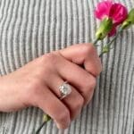 Custom Embrace with prongs and carnation BG Embrace, from Brown Goldsmiths Signature Collection. Platinum and 18k yellow gold with a diamond on a hand.